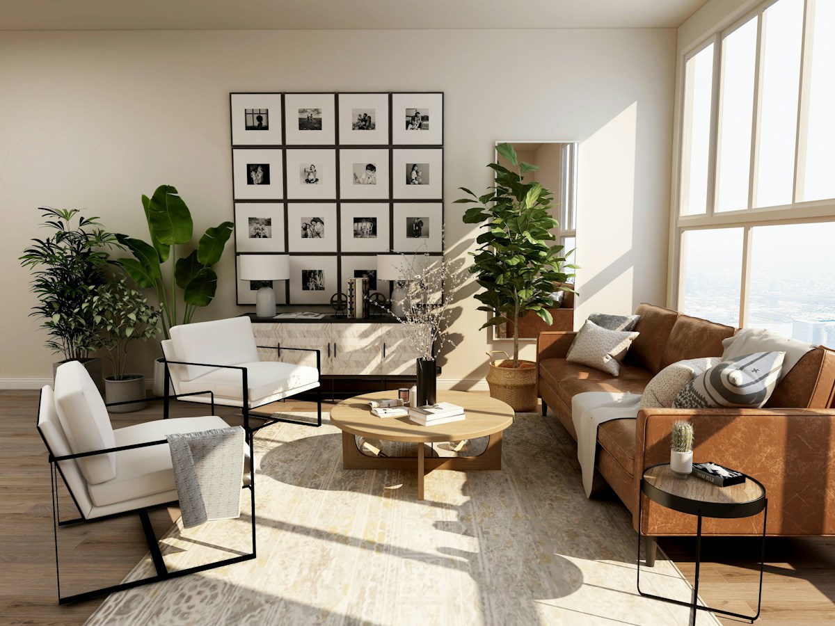 A warm, light-filled living room with comfortable furniture and greenery